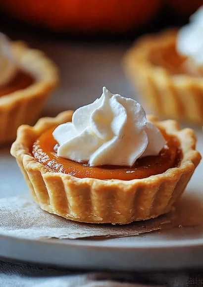 Delicious sweet mini pumpkin pies ready to be served for fall desserts.